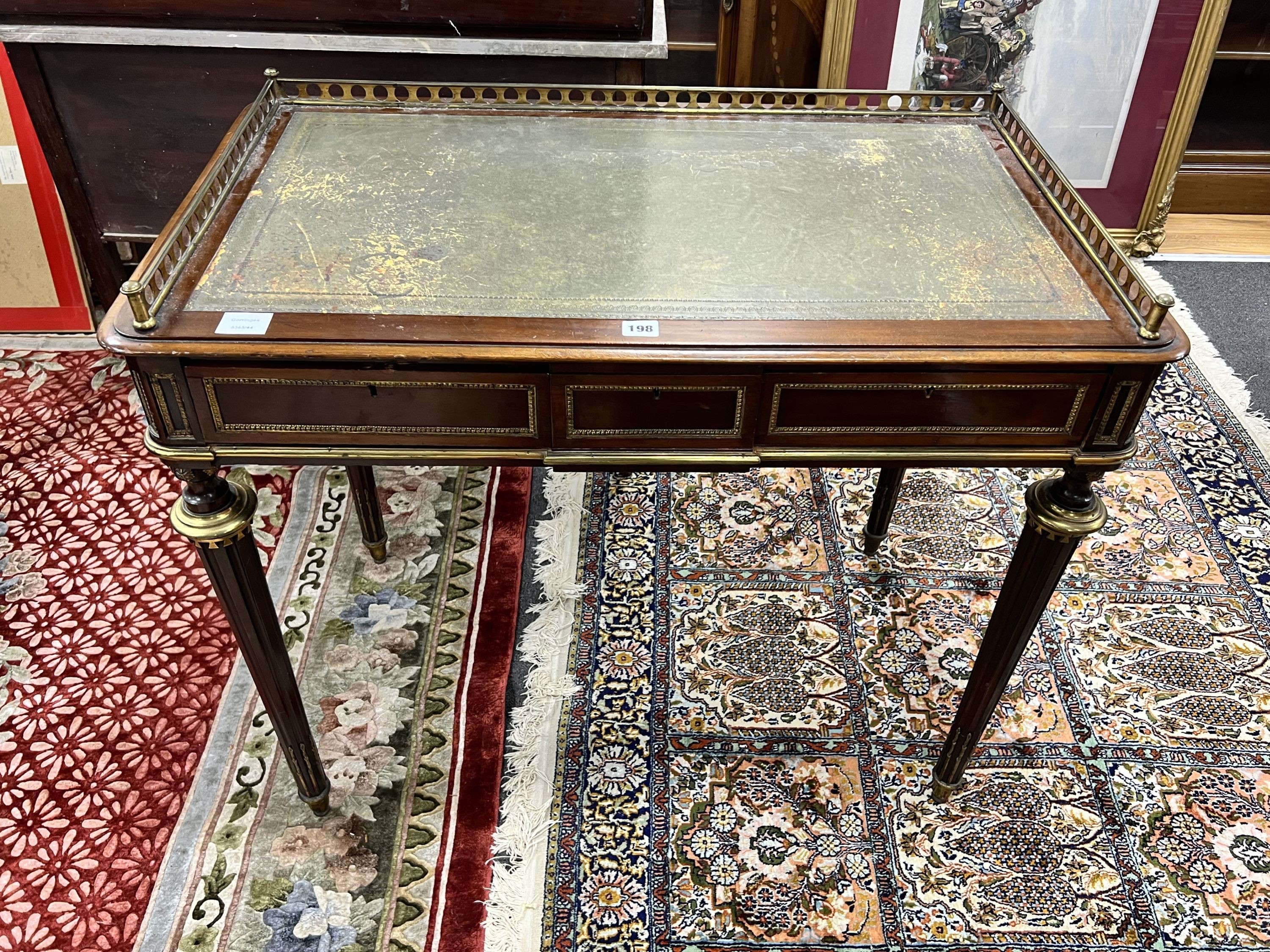 A late 19th century French ormolu mounted mahogany two drawer writing table, width 94cm depth 55cm height 79cm